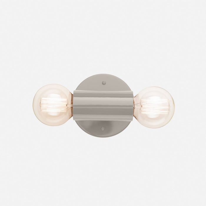 Front view of the Cylinder Double Sconce showcasing its gray gloss finish and two exposed bulbs on a white background