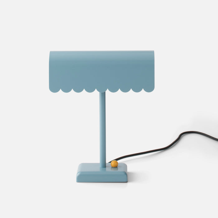 Front view of Dolores Table Lamp showcasing its scalloped edge and contrasting dimmer knob on a white background