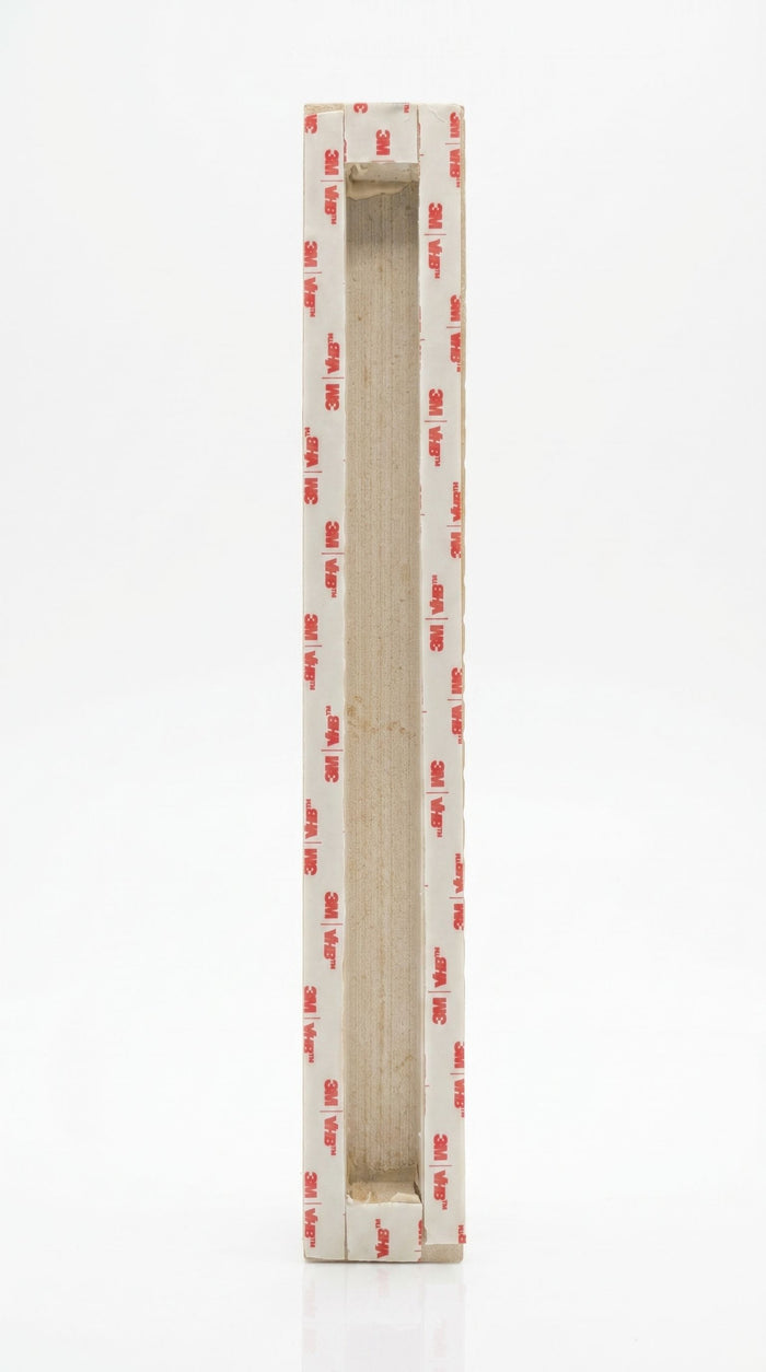 Back of an extra large sized Shaddai Ramparts Jerusalem stone mezuzah showing long recessed scroll chamber and included mounting tape