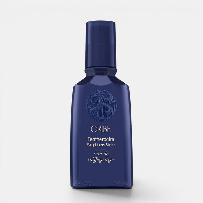 Shop Rescue Spa Oribe Featherbalm Weightless Styler in a dark blue 100ml bottle for fine to medium hair styling.