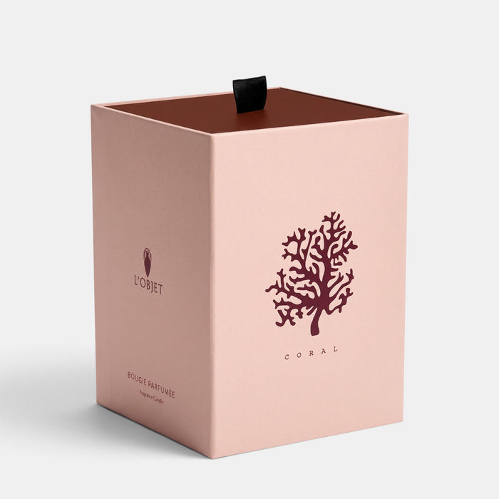 L'Objet Footed Coral Candle in a blush pink presentation box with coral graphic and black ribbon pull