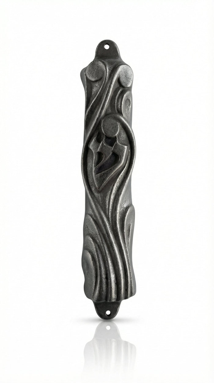 Upscale pewter mezuzah from Israel with detailed Hebrew engravings and decorative motifs, displayed on a white studio background with subtle reflection.