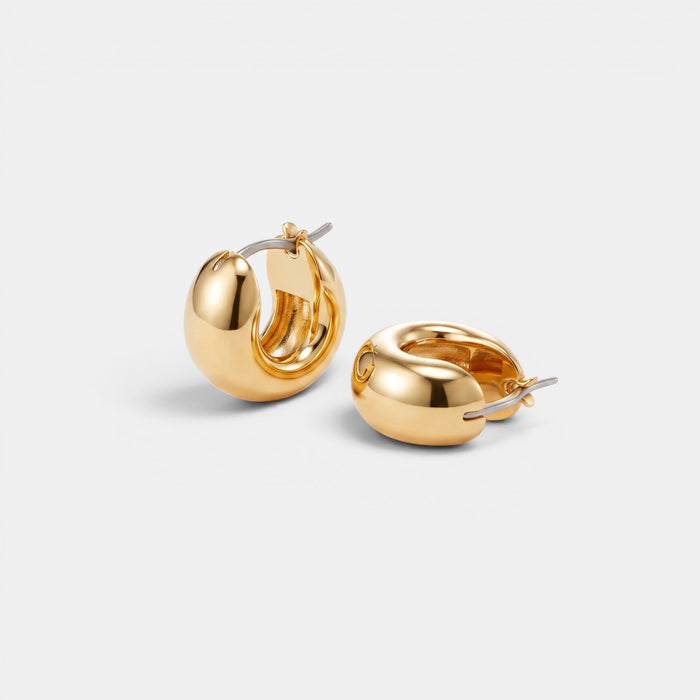 Shop Rescue Spa Mini Tome hoop earrings in high-polish gold with a convenient hinged closure design.