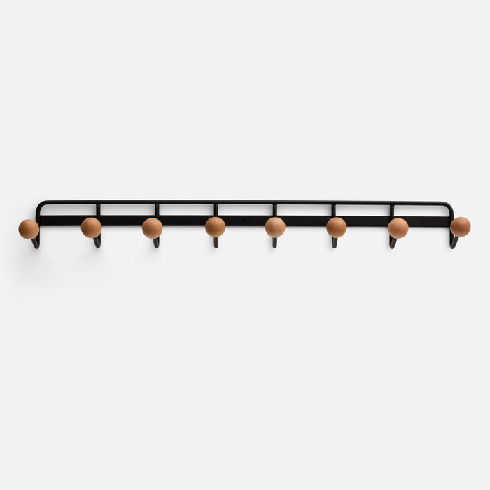 Overhead view of Mollie Multi Hook showing eight oak knobs on a black painted steel rail against white background