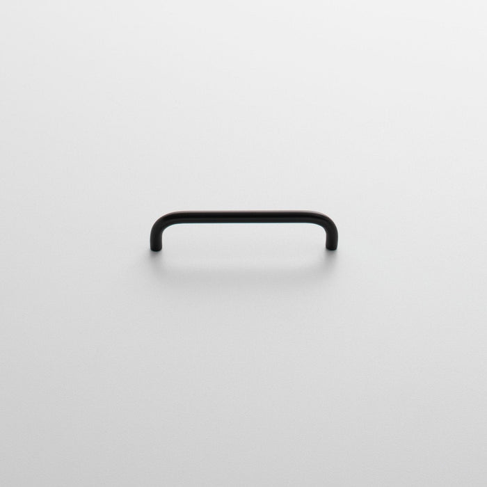 Front view of Parker Pull showcasing its rounded rectangular shape and black finish on a light background
