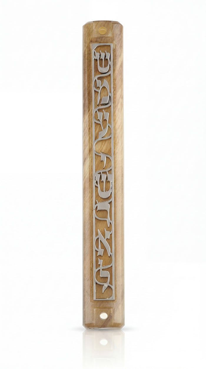 Close-up of acrylic Shema Mezuzah on white background with reflection, highlighting intricate details and craftsmanship.