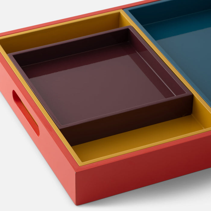 Close-up view of Stacking Trays, Set of 4 showcasing four nested lacquer-finished trays in muted colors on a white background